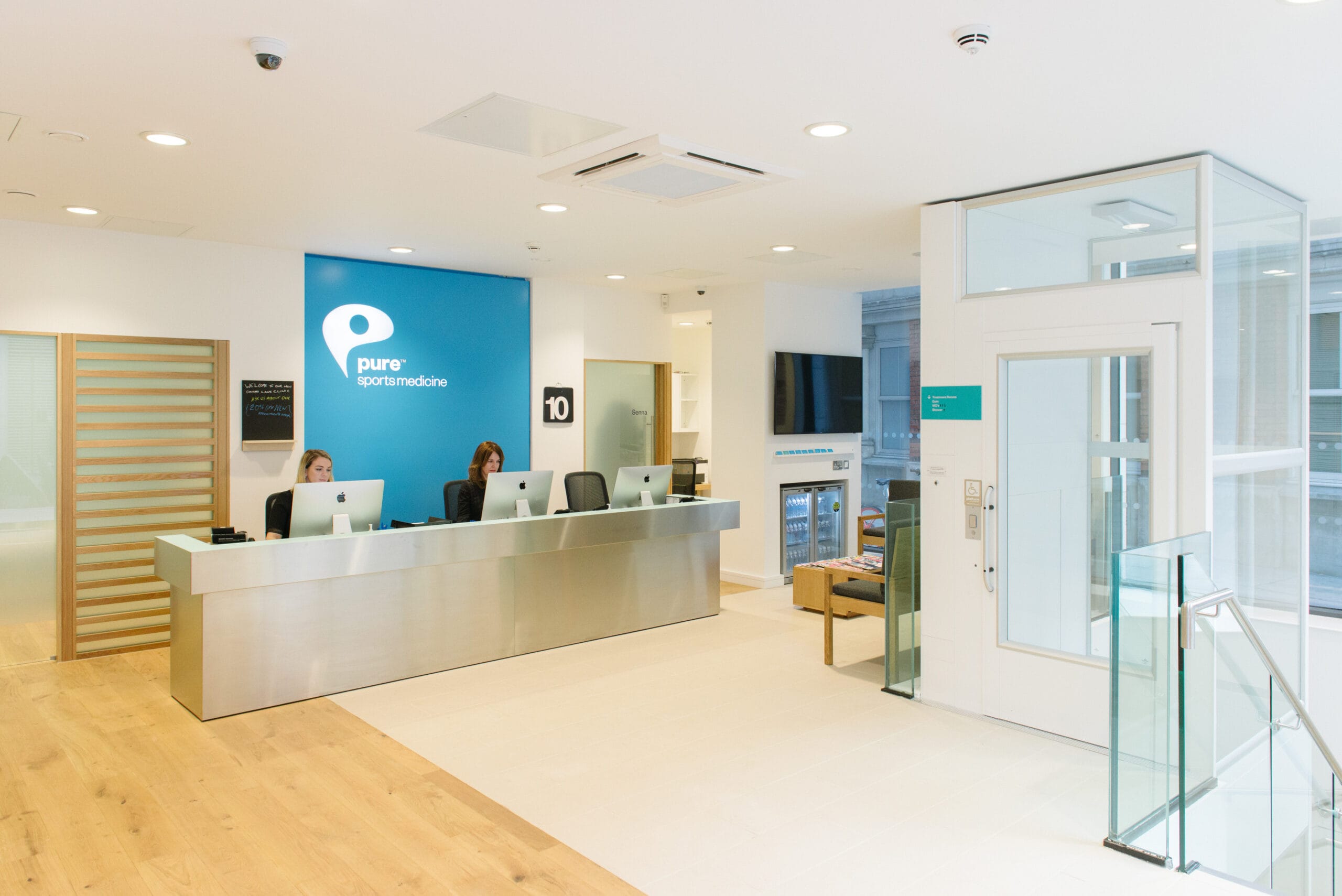 Pure Sports Medicine Chancery Lane reception with 2 receptionists