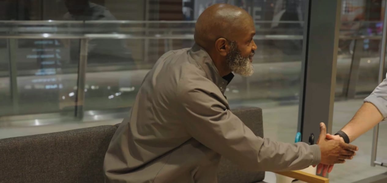 a man shaking someones hand