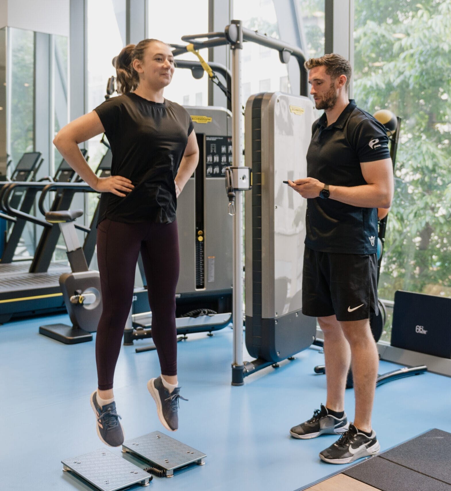 person jumping on forcedecks while clinician watches