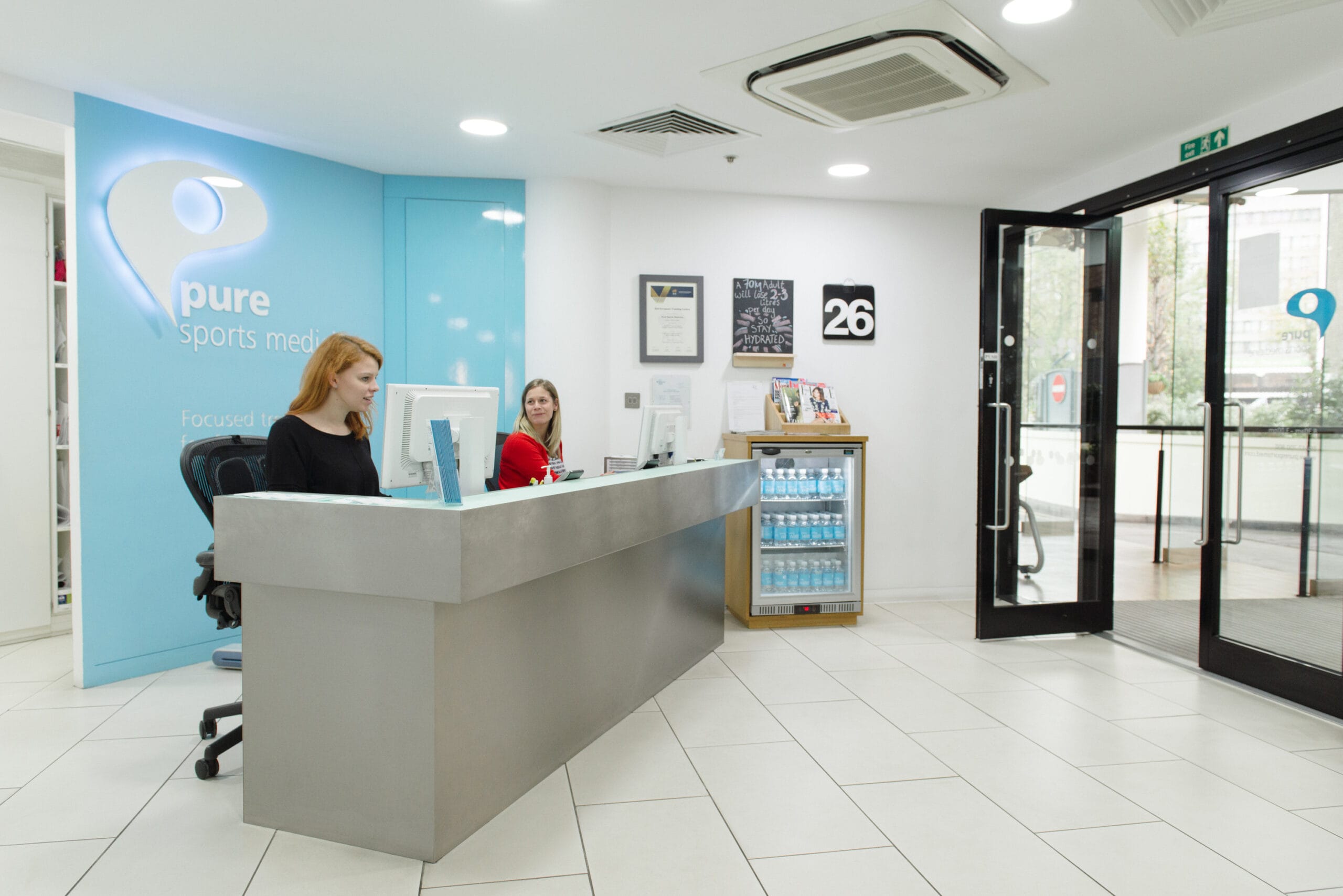 Pure Sports Medicine Kensington Reception Desk with 2 receptionists
