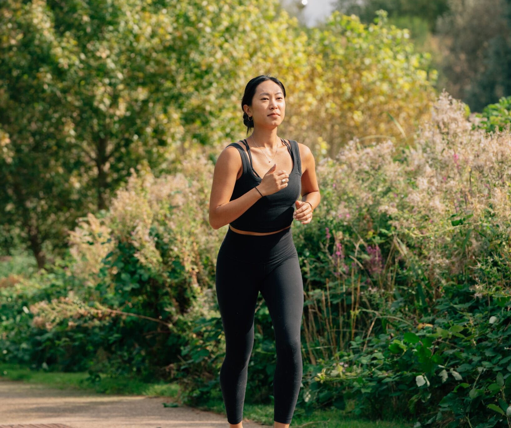 a woman running through nature