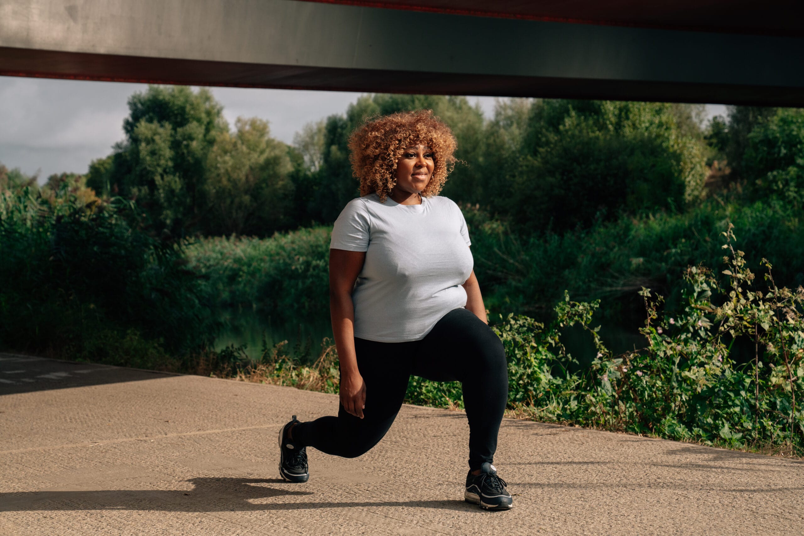 women bending knee stretch