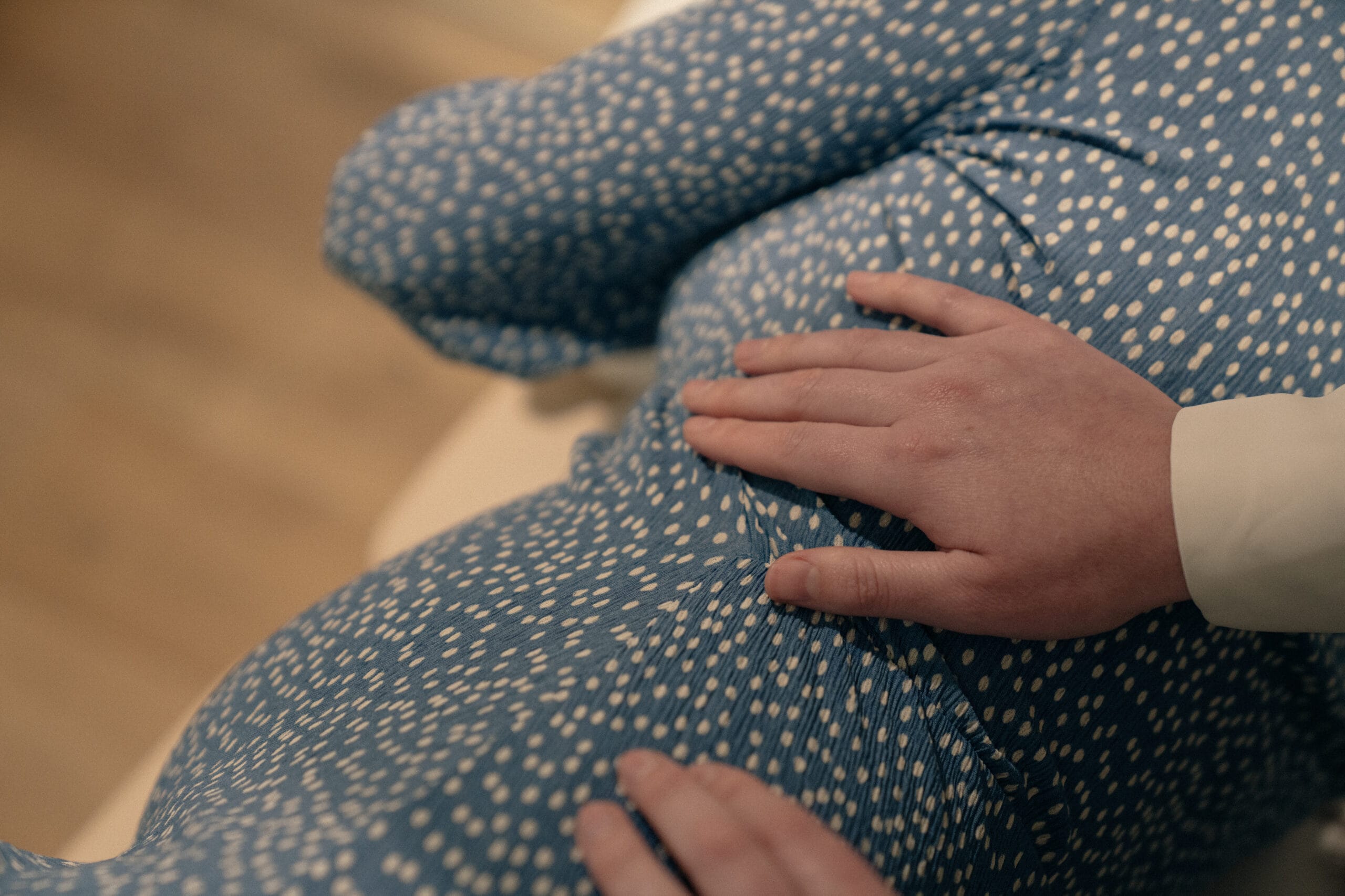 close up of a pregnant woman's side laying down