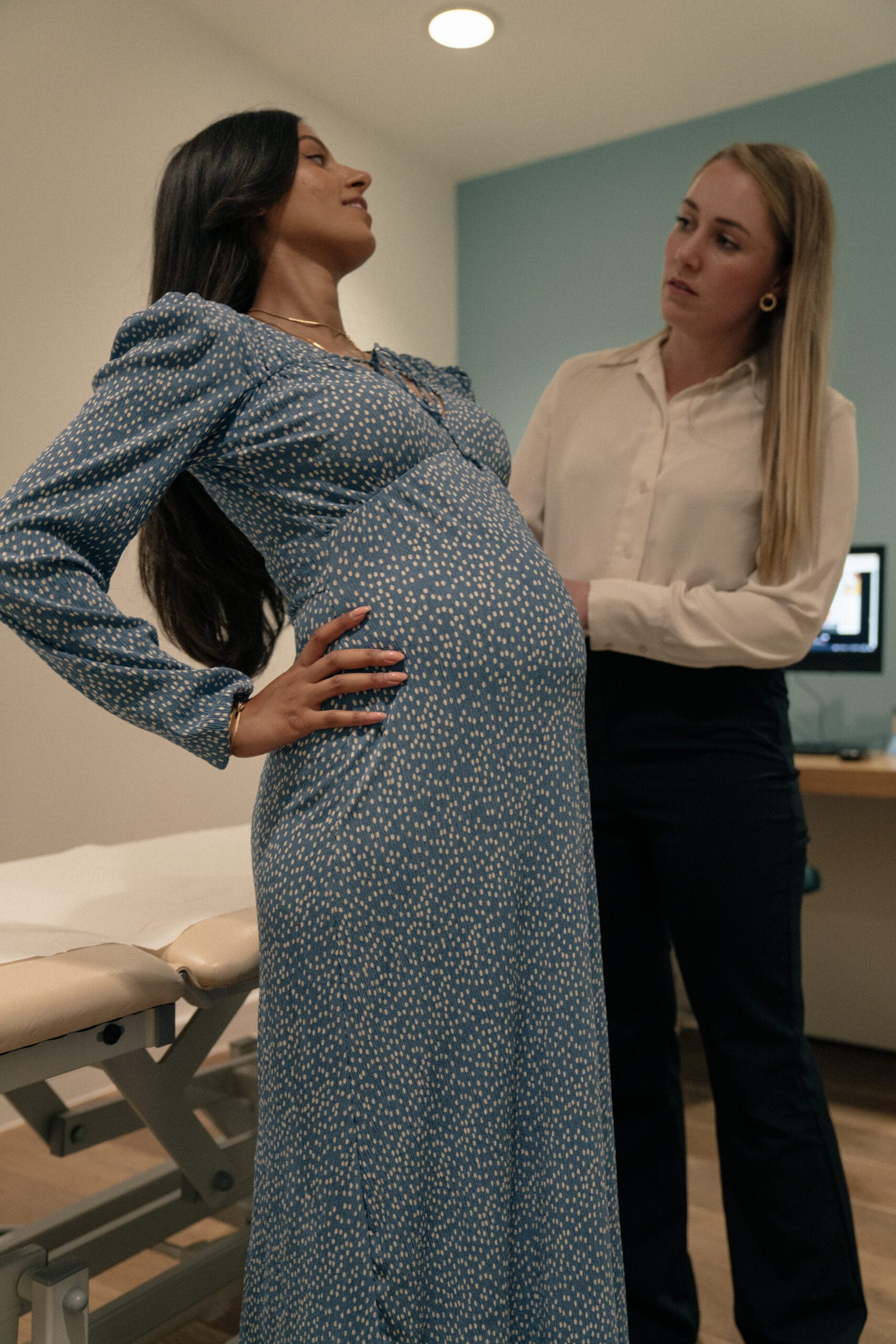 pregnant women being assessed by clinician