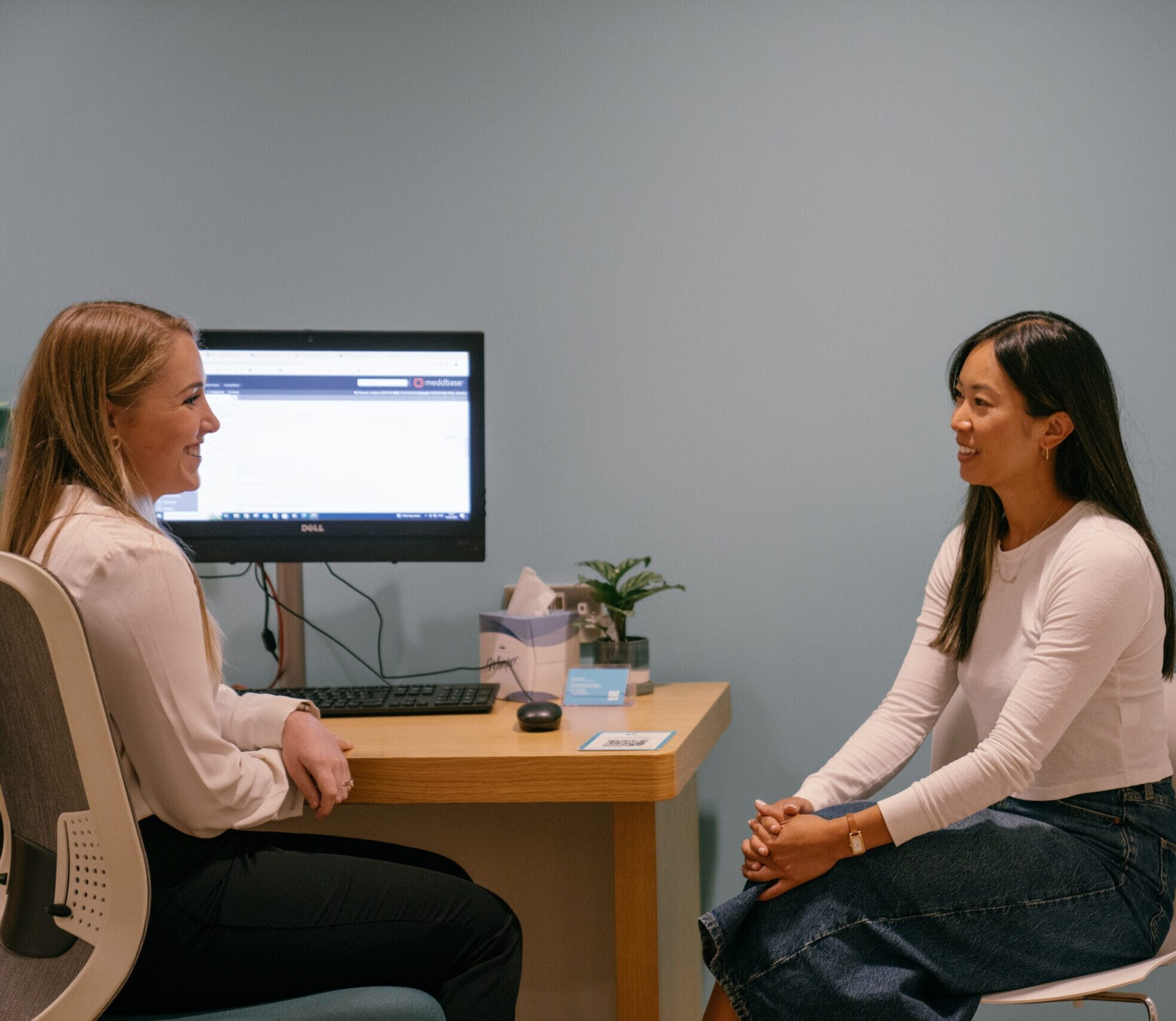 Patient talking to clinician in appointment room