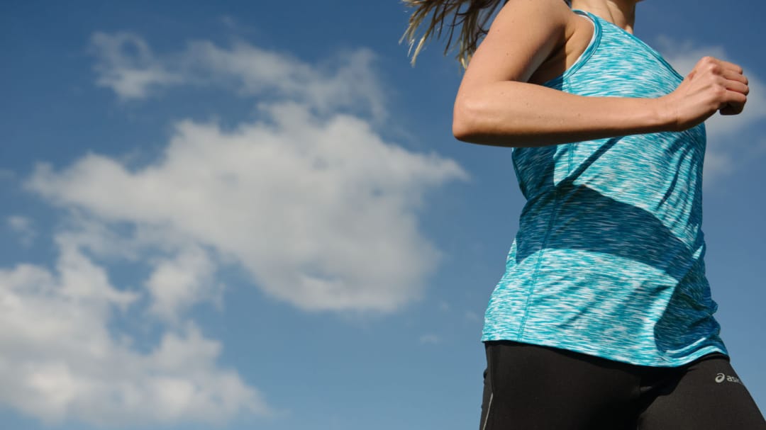 close up of woman running outside